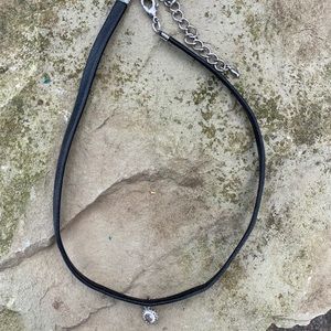 Black choker with crystal pendant